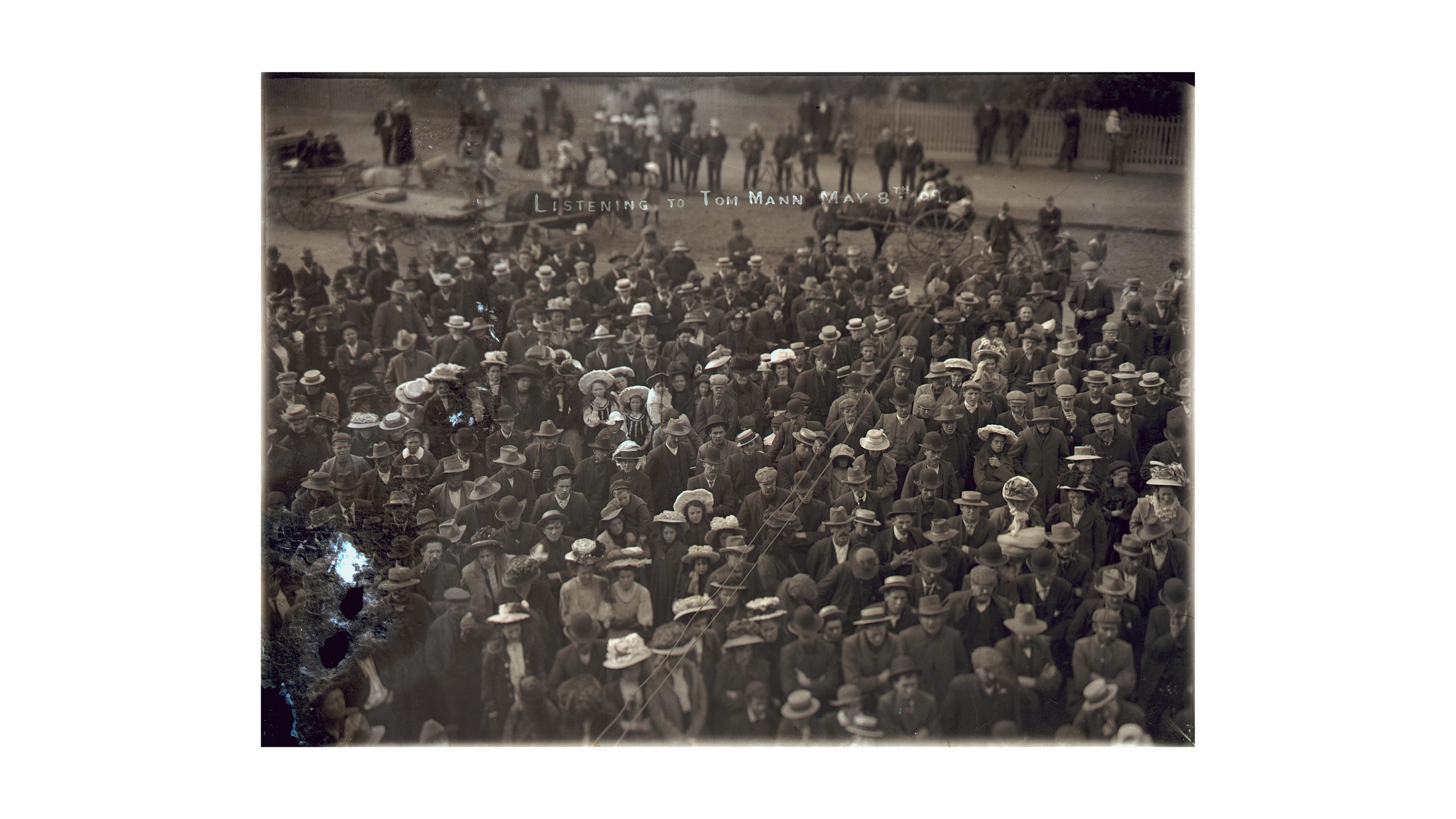 black and white photograph of a gathered crowd taken from above
