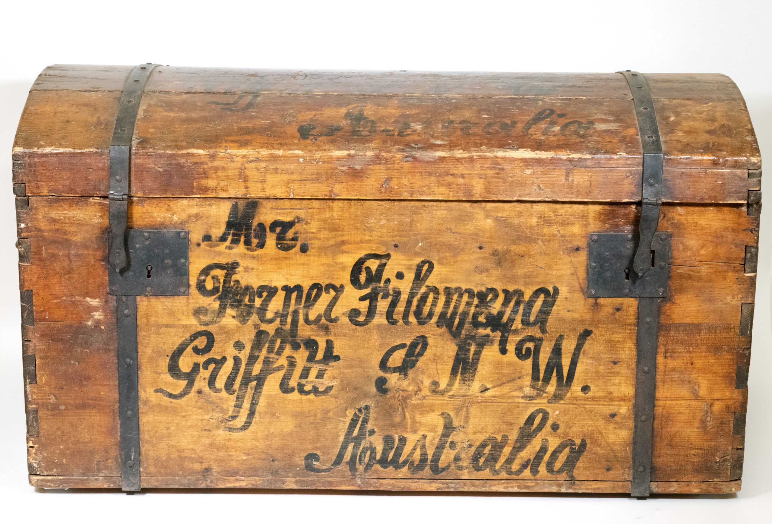 wooden trunk with metal hinges and locks, it has some black lettering which reads Mr. Forner Filomena Griffitt J.N.W. Australia'