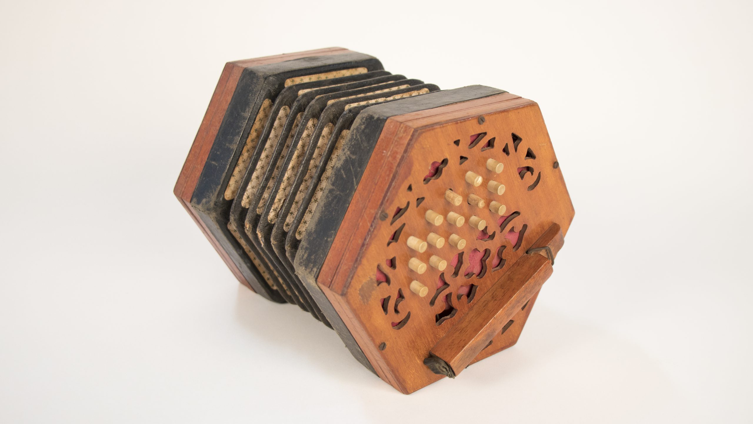 hexagonal. wooden concertina, it looks similar to a small accordian