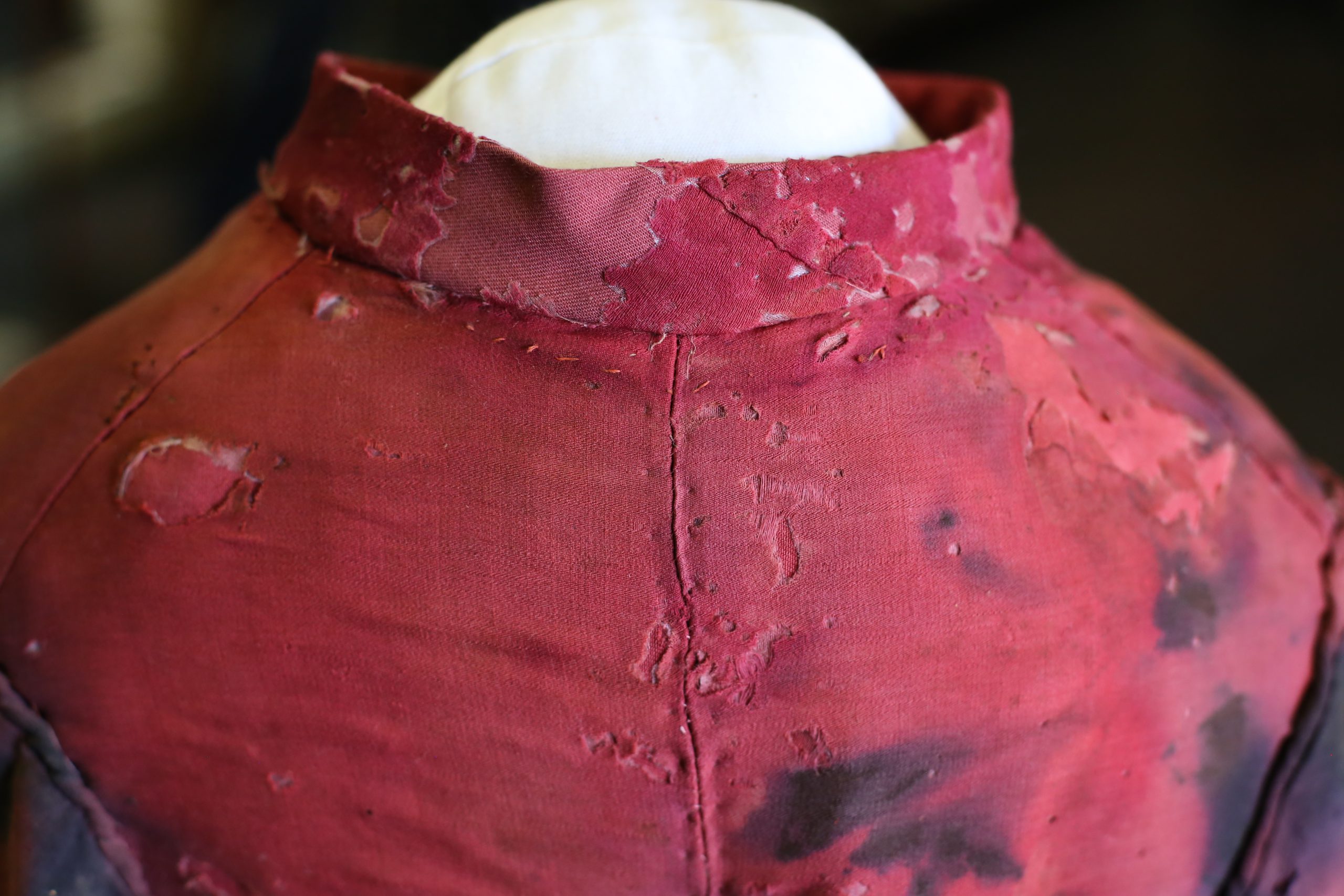 back of damaged red cloak