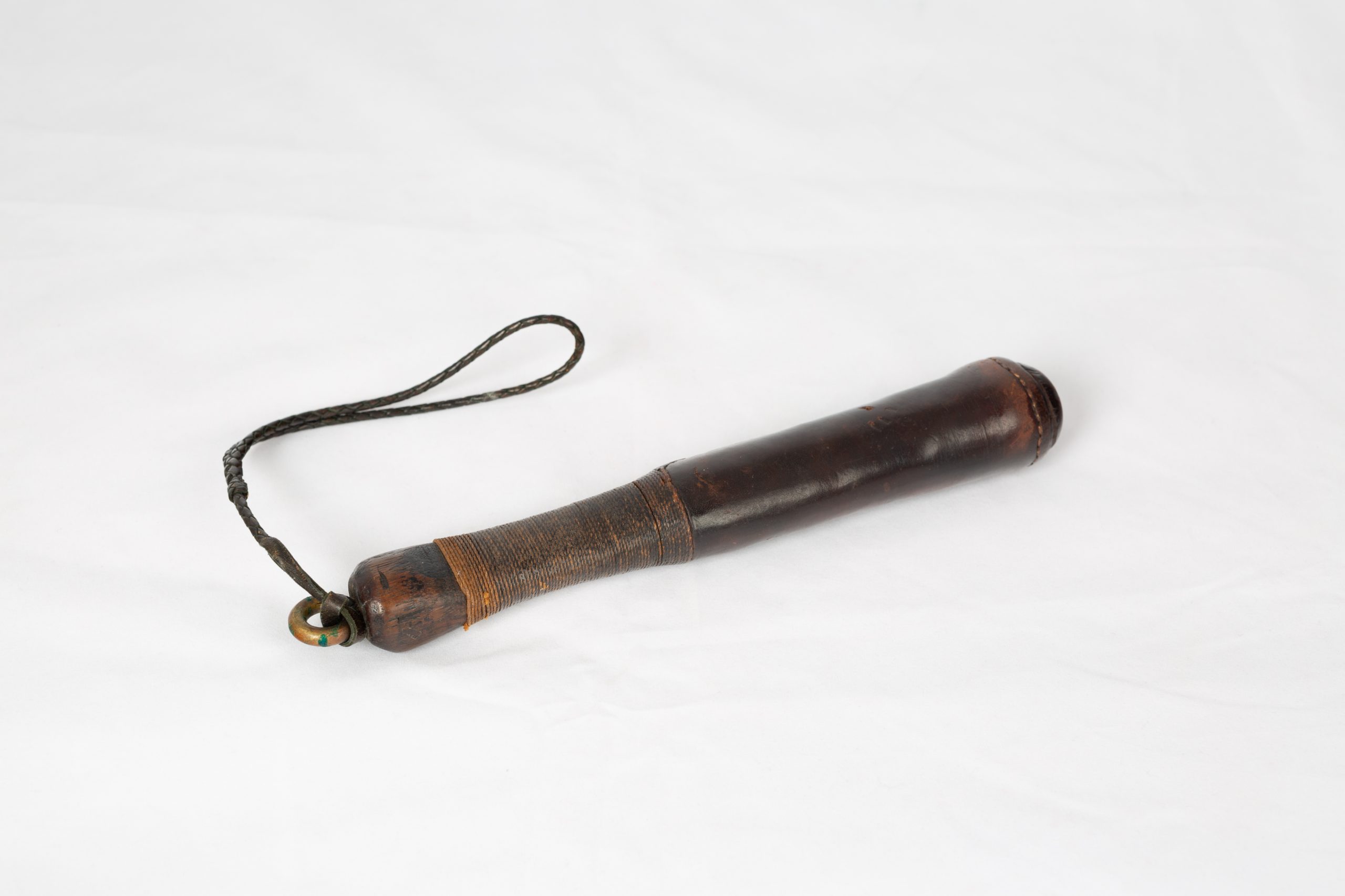 wooden baton/club covered in leather with wrist strap