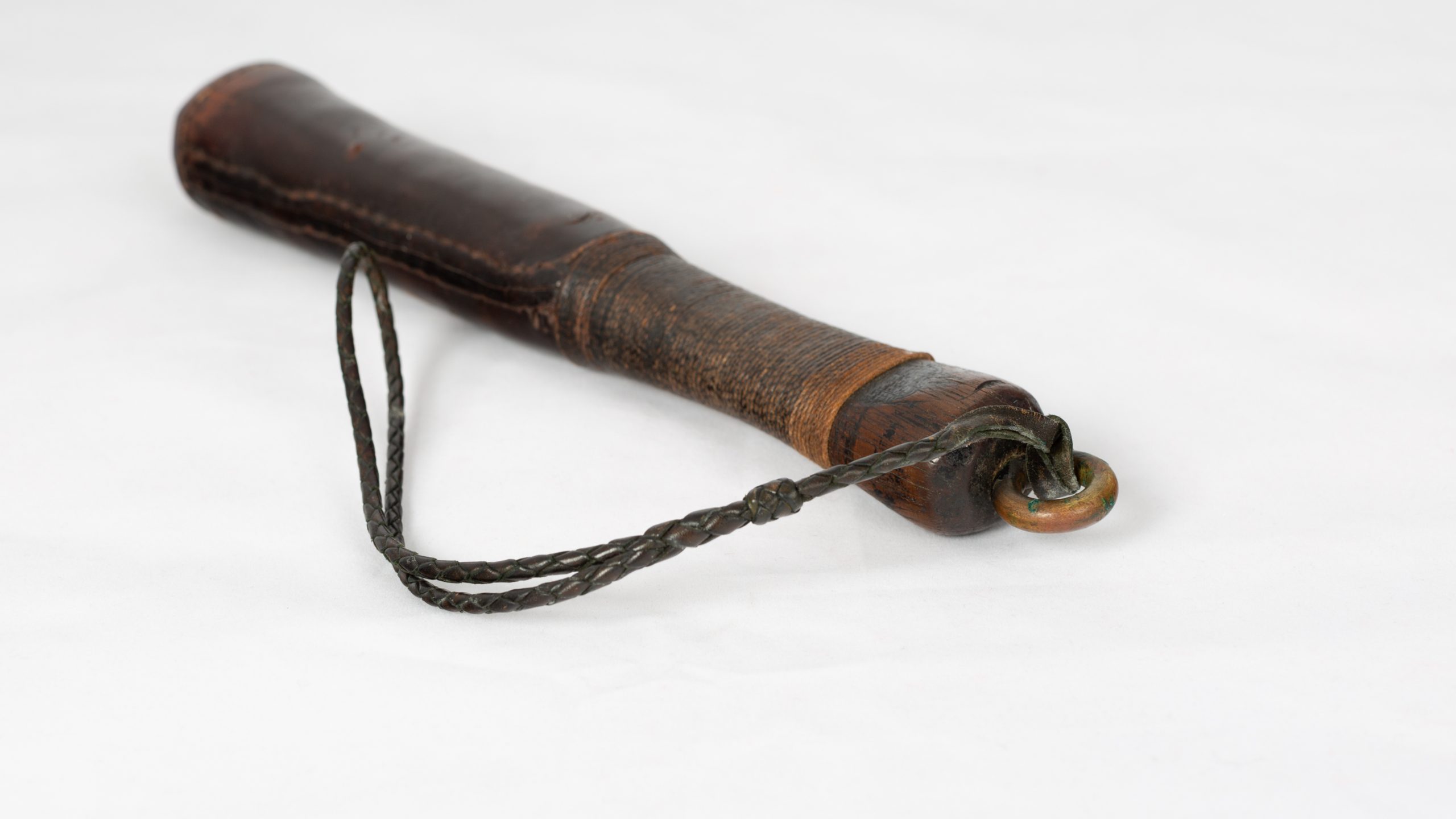 wooden baton/club covered in leather with wrist strap