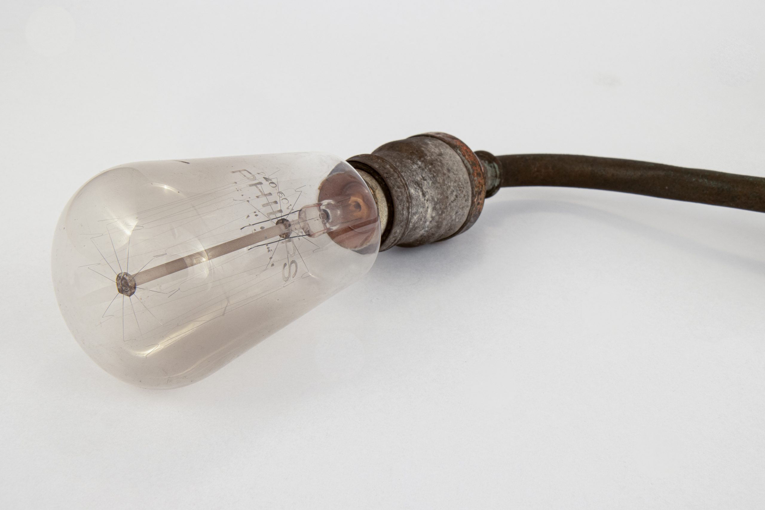antique lightbulb attached to metal light fitting