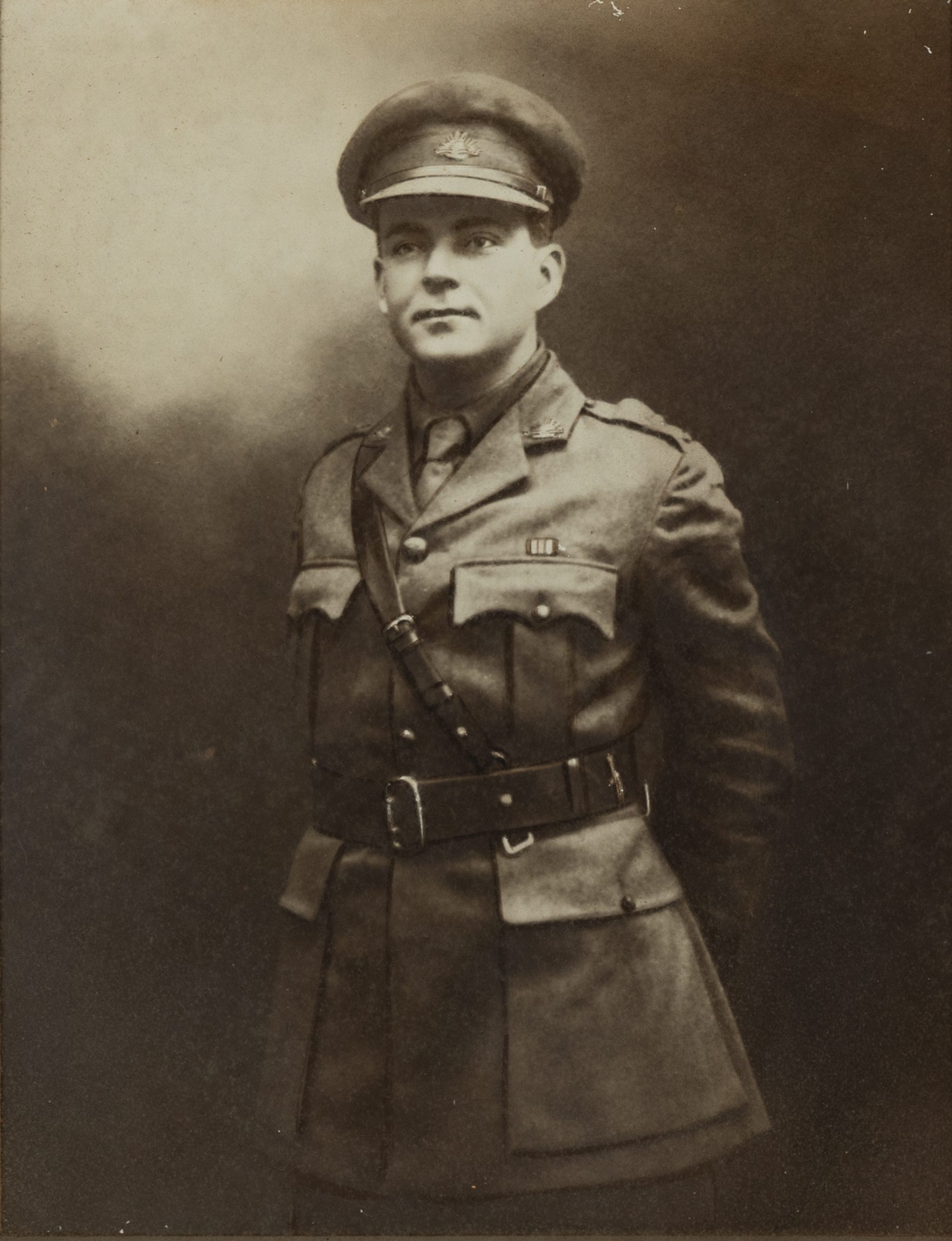 black and white portrait of a soldier with hands behind his back
