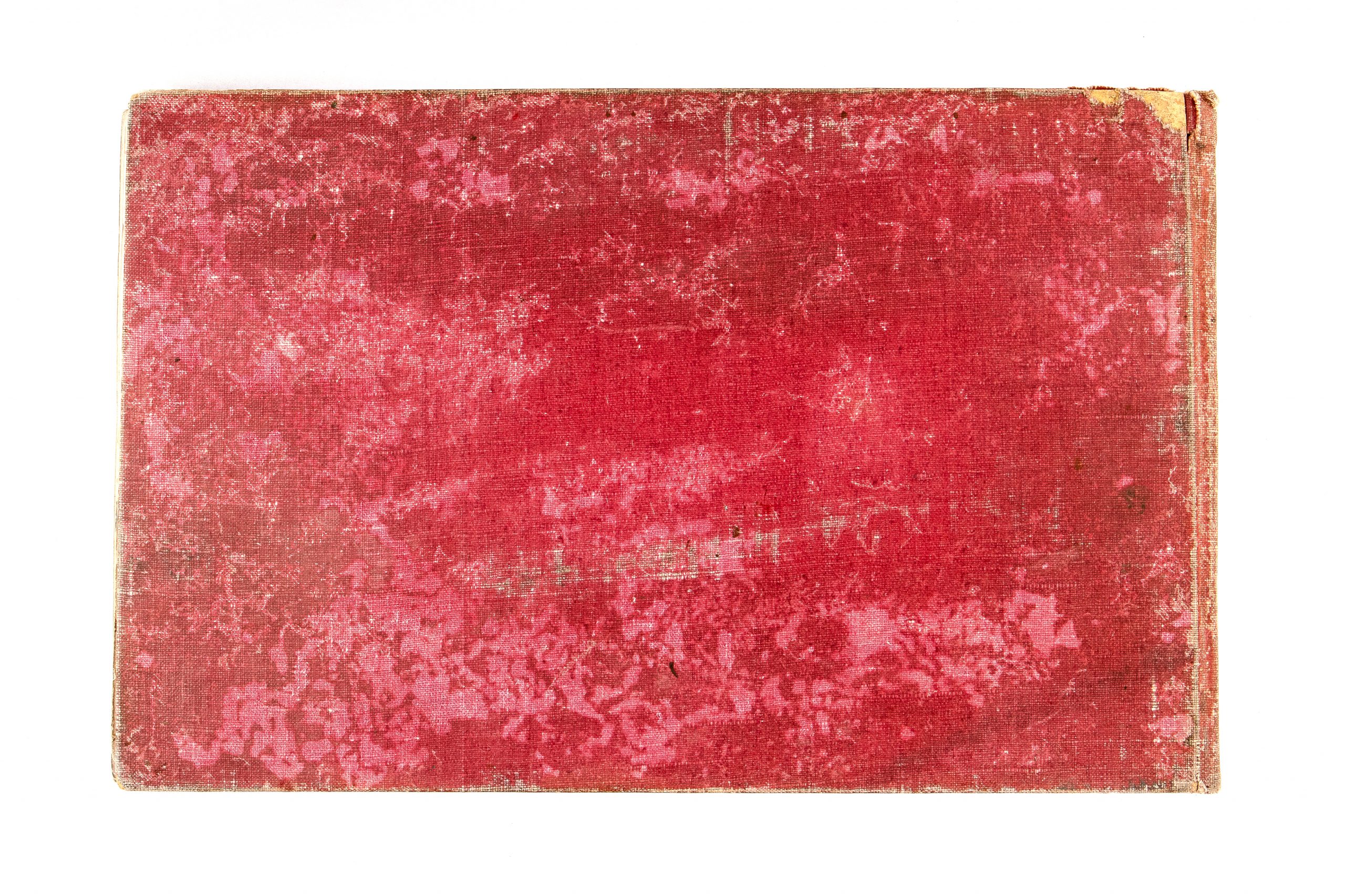 bsck of heavily tarnished red cover