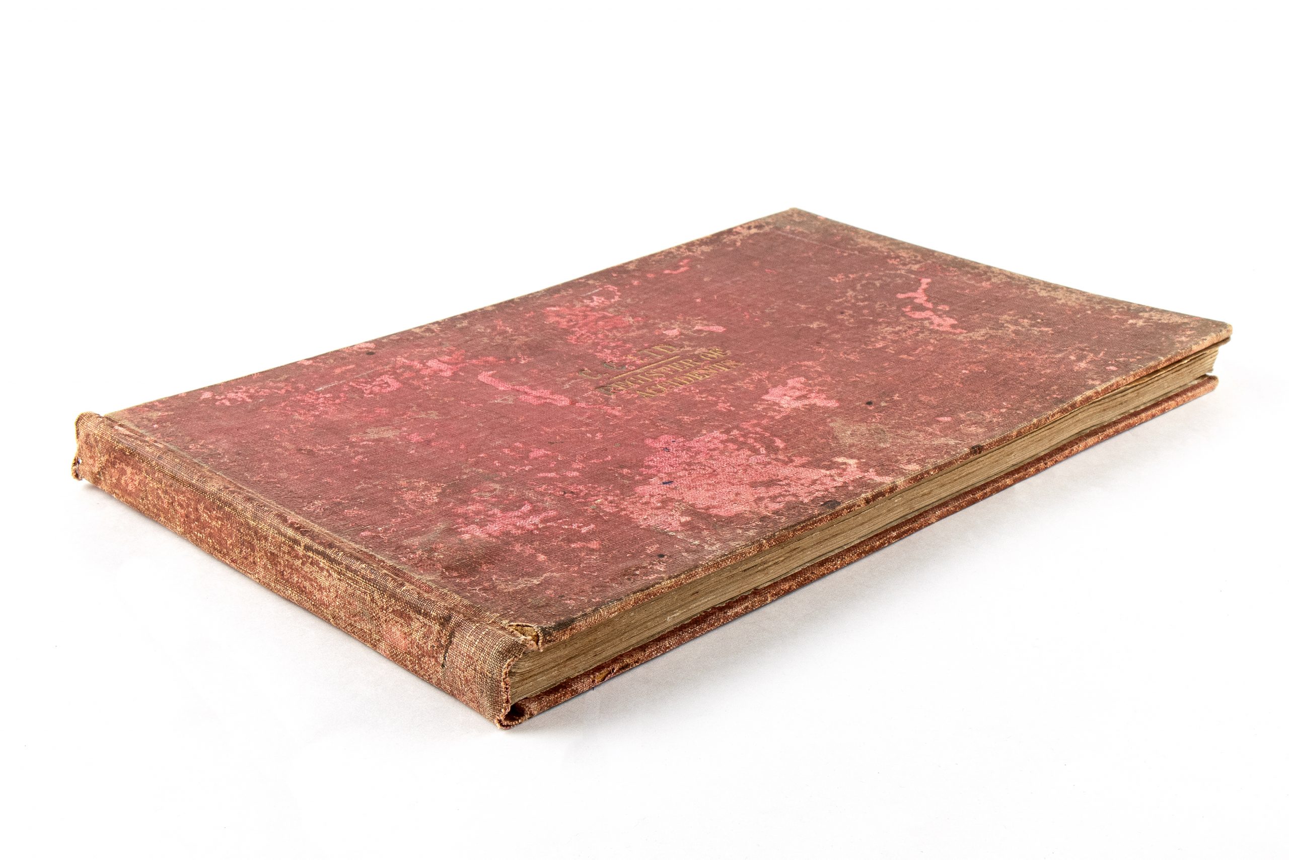 heavily tarnished red cover with gold lettering reading 'C.C.LTD. REGISTER OF ACCIDENTS'