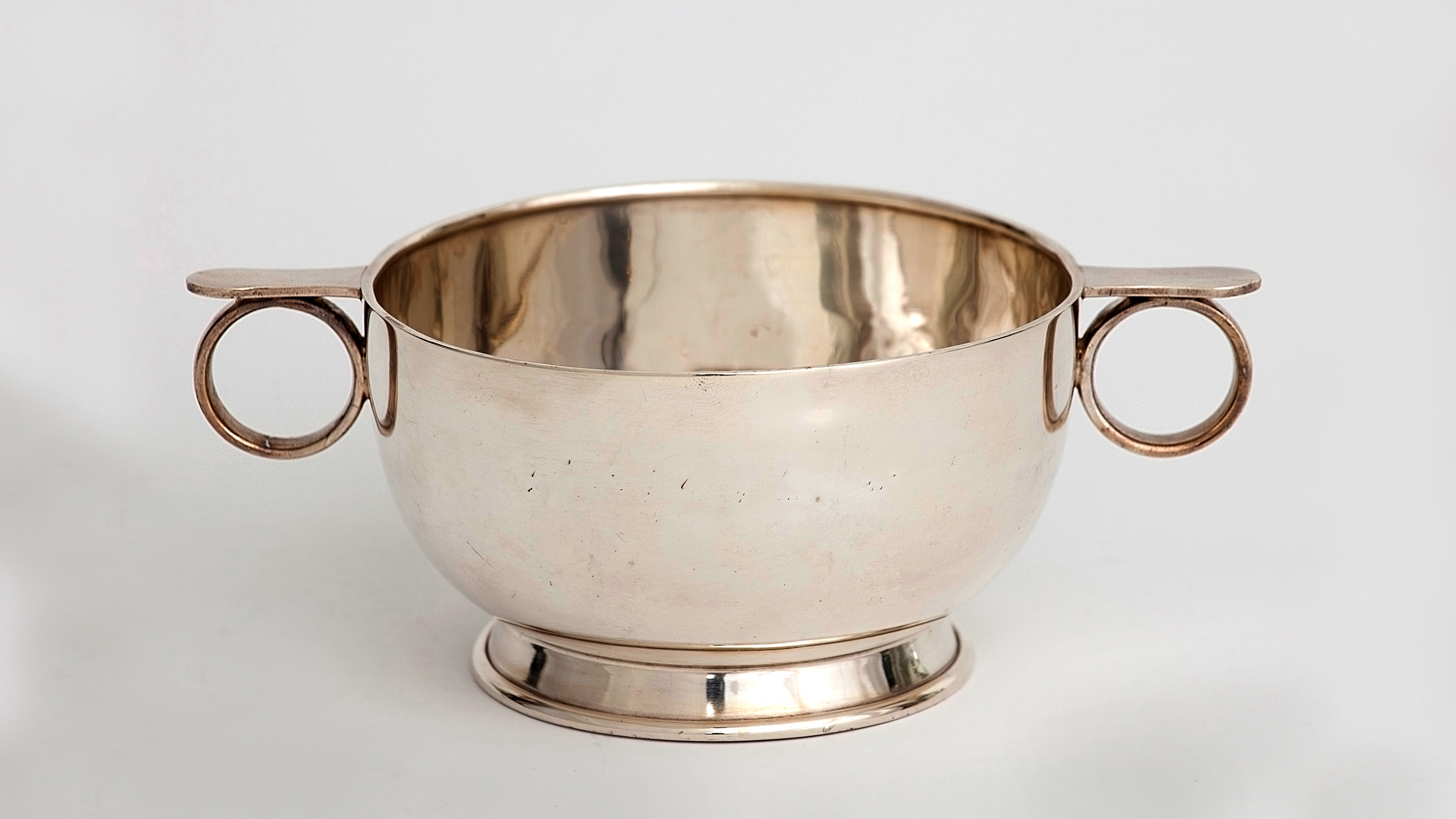 Slightly oxidised, silver bowl with small circle handles